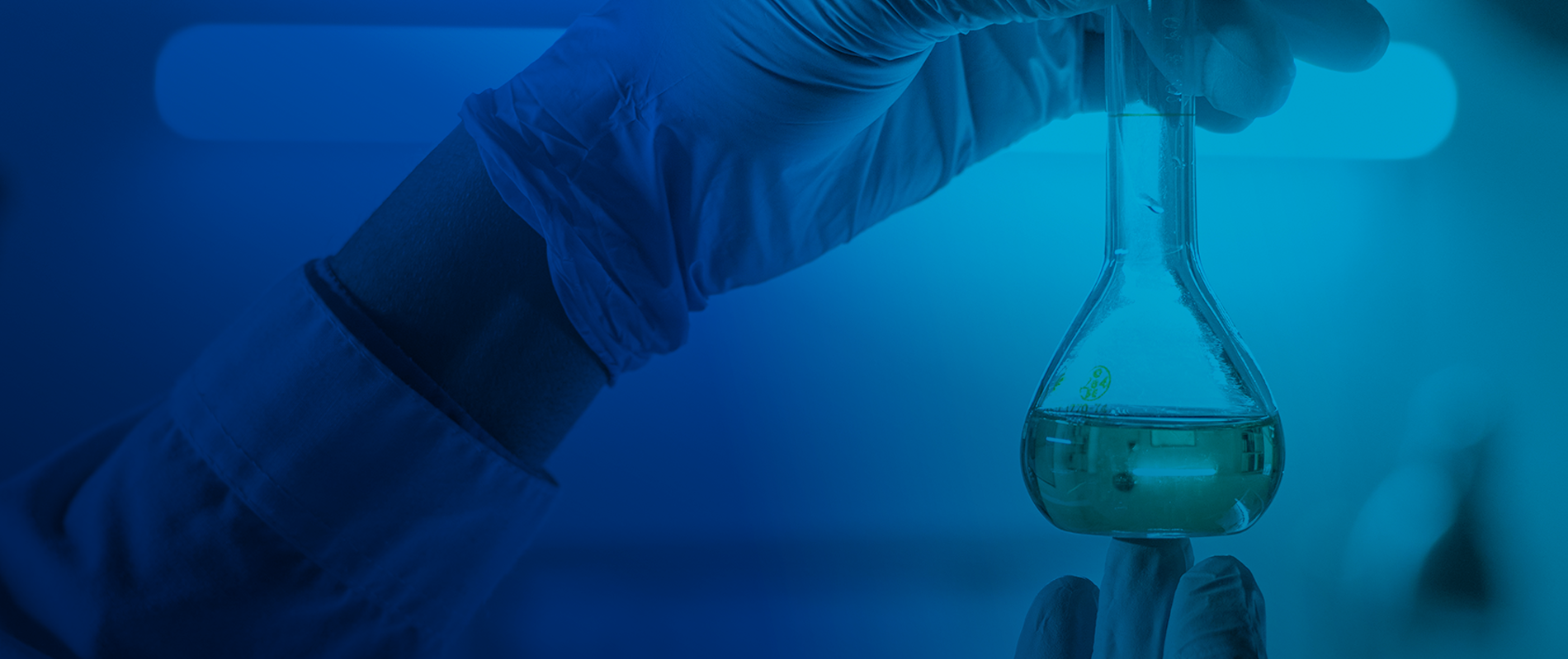a science flask with gloves